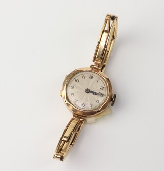 A lady's 9ct yellow gold octagonal wristwatch on a gilt bracelet 