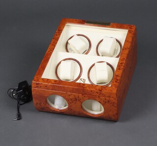 A Steinhausen walnut cased electric four watch winder 