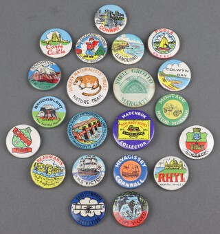 Twenty one 1950/60's English resort badges including Llanfairpwllgwyngyllgogerychwyrndrobwllllanty-llantysiliogogogoch, Snowdon, Colwyn Bay, Conway, Rhyl, Beddgelert, Betws-y-coed, Bangor, Llandudno, HMS Victory, Black Gang Chimes Isle of Wight, Corfe Castle, Windsor, Beaumaris, Mevagissey, Poole Dorset, Shuttleworth Collection, Montagu Motor Museum, Shell Grotto Margate, Surrey Naturalists Trust and The Matchbox Collector's Club 