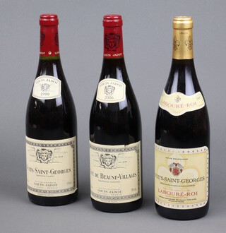 A bottle of Louis Jadot Cote de Beaune-Villages 2006,  bottle of Louis Jadot Nuit-Saint Georges 1999, and a bottle Nuits-Saint-Georges Laboure-Roi 2005 red wine 