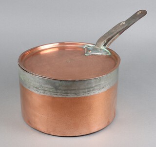 A 19th Century copper saucepan with steel handle, the lid with Dukes Coronet marked W, the side marked TR15, 15cm x 27cm 