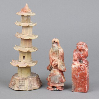 A 19th Century carved soapstone seal decorated a Dog of Fo 11cm x 4cm x 4cm (chipped), ditto figure of a standing lady 12cm and a soapstone model of a pagoda 20cm x 7cm (stuck)