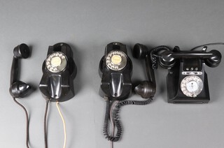 Two GEC black Bakelite telephones, 1 marked ST.52501 (chip to ear piece and mouth piece), the other Tel/1M/AWS together with a black Bakelite dial telephone 164 47 with label to base 314LGPO 