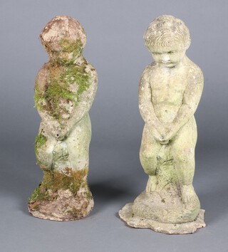 Two similar well weathered concrete fountains in the form of standing boys 64cm h x 28cm w x 25cm d 