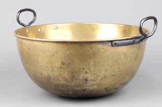 A  19th Century circular brass bowl with polished iron handles 19cm h x 39cm diam. 