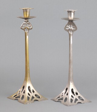 A pair of Art Nouveau style pierced ex silver plated candlesticks, raised on square bases 36cm x 11cm, 