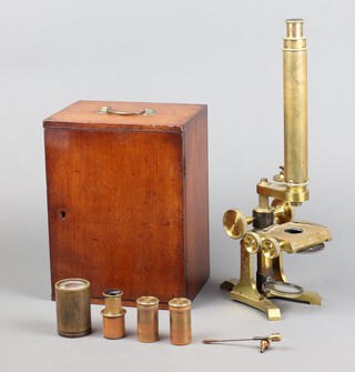 E Burton of 47 Church Street, London, a single pillar microscope together with 2 objective brass cased tubes, spare eye piece, all contained within a mahogany case 