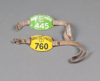 A City of London yellow enamelled Market Porter's armband no. 760 and a green enamelled ditto no. 445 with leather straps and buckle