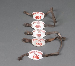 5 City of London red and white enamelled Market Porter's armbands nos. 404, 409, 410, 446 and 448 with leather straps and buckle