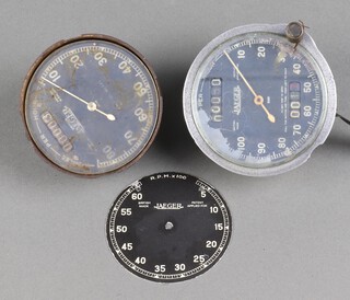 A Jaeger speedometer, the dial marked 6461 9cm, 1 other marked 12148 (glass loose) 8cm, a Jaeger aluminium speedometer dial R.P.Mx100 7cm 