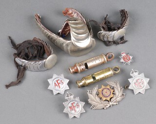 A City Police or Fire Whistle "The Metropolitan Whistle" dated 1909 with broad arrow, National Fire Brigade Association cap badge, Auxiliary Fire Service cap badge and lapel badge, 2 National Fire Service cap badges, 3 various epaulettes 