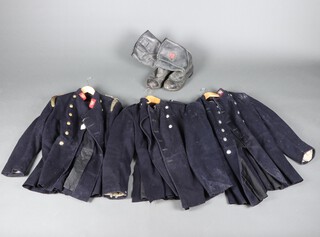 A Greater London Council Fire Brigade double breasted tunic with gilt buttons and epaulettes, labelled 42 Reg. 1970/71/72, 1 other double breasted tunic (some moth), a West Sussex Fire Brigade double breasted tunic together with a pair of Tuffking size 12 fireman's boots  