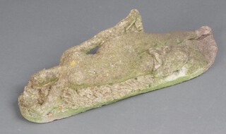 A well weathered concrete figure of a reclining naked lady 19cm x 56cm x 17cm 