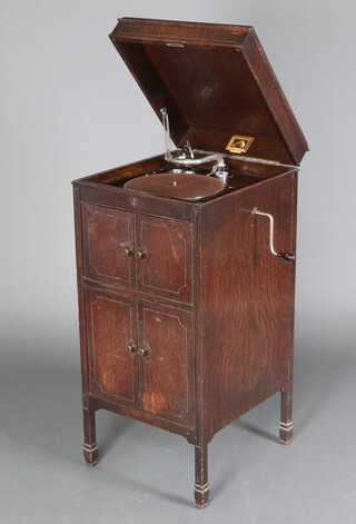 A 1930s HMV standard Gramophone model 162 with No. 4 soundbox contained in a fitted oak cabinet, 104cm h x 47cm w x 52cm d