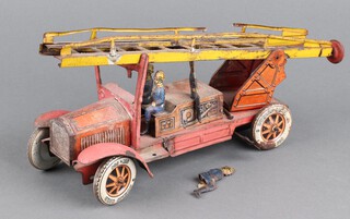 A Tipp & Co? tinplate clockwork fire engine with four firefighters (one loose) ,  Dunlop tyres and extending ladder (a/f ) 25cm l x 13cm h