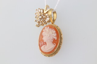 An 18ct yellow gold cameo pendant 2 grams gross, together with a 14ct yellow gold paste set pendant  1.5 grams gross 