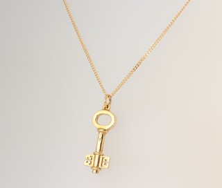 A Theo Fennell 18ct yellow gold double key charm and chain, the chain 40cm, 4.6 grams 