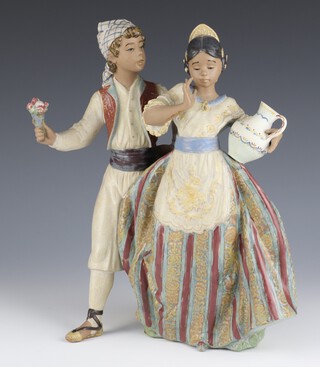 A Lladro matte finish group of a young man and lady 2239, 30cm  