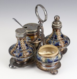 A Doulton Lambeth 4 piece condiment set decorated with flowers dated 1881, with silver plated mounts and and stand