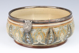 A Doulton Lambeth bowl with floral and geometric decoration by Frank A Butler, having a silver rim with badge inscribed Walton on Thames Regatta London 1891, 238 23cm 