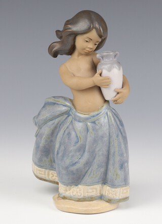 A Lladro matte finish figure of a girl holding a vase 2331 19cm 