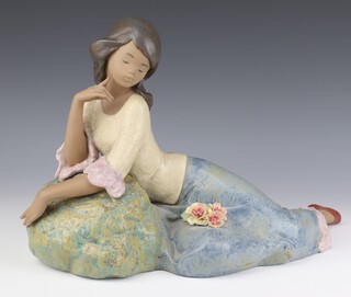 A Lladro matte finish figure of a lady reclining on a rock 2148, 27cm 