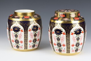 A Royal Crown Derby Imari pattern  ginger jar (no lid) 1128L11 17cm, another with lid L28L1 19cm (the second jar has a cracked body and stuck lid) 