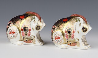 A pair of Royal Crown Derby Imari pattern paperweights in the form of polar bears with silver stoppers, marked LX11 and LX1 8cm 