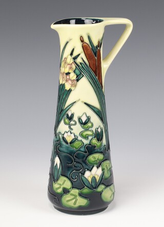 A modern Moorcroft, Lamia pattern jug designed by Rachel Bishop, the cream ground decorated with flowers, dated '95, impressed marks 23cm 