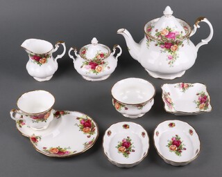 A Royal Albert Old Country Roses part tea set comprising teapot, cream jug, sugar bowl, lidded sugar bowl, bread plate, 6 tea plates, 2 small oval dishes, small square dish, 6 tea cups, 7 saucers, 3 mugs, 2 sandwich plates 