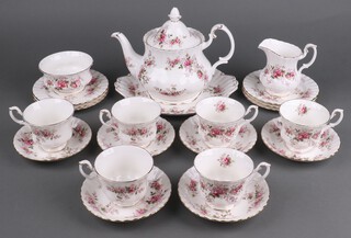 A Royal Albert Lavender Rose pattern part tea set comprising teapot and lid, bread plate, milk jug, sugar bowl, 6 tea plates, 6 tea cups, 6 saucers 