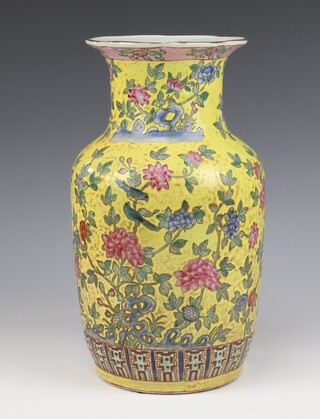 A 20th Century Chinese  baluster vase decorated with scrolling flowers on a yellow ground 35cm 