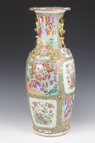 A 19th Century Cantonese oviform vase with dragon handles decorated with panels of figures on pavilion terraces and panels of birds and flowers 64cm h 