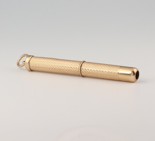 A 9ct yellow gold engine turned toothpick, gross weight 6.1 grams 