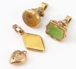 Two 19th Century gilt hardstone seals, a diamond shaped locket and a heart shaped 9ct gold pendant 0.5 grams