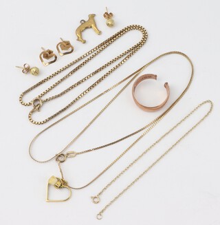 A 9ct yellow gold necklace 44cm hung a heart shaped pendant, a 9ct yellow gold necklace 34cm, a bracelet 18cm, a pendant in the form of a dog and 2 pairs of ear studs, 6.4 grams 