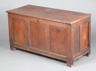 An 18th Century oak coffer of panelled construction with hinged lid and iron lock 68cm h x 126cm w x 55cm d 