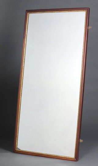 A 19th Century rectangular plate mirror contained in a walnut and gilt finished frame 142cm x 67cm 