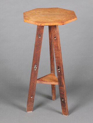 An Art Nouveau Liberty style light oak 2 tier occasional table, raised on pierced outswept supports 77cm h x 38cm w x 38cm d 