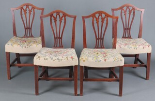 A set of 4 Georgian mahogany Hepplewhite style dining chairs with pierced vase shaped slat backs and overstuffed seats, raised on square supports with H framed stretcher 95cm h x 53cm w x 46cm d (seats 32cm x 30cm) 