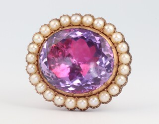 A yellow gold, testing as 9ct, oval foil backed amethyst and seed pearl brooch, 15 grams, 30mm