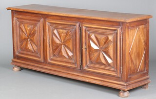 An 18th/19th Century French walnut dresser base enclosed by 3 panelled doors, raised on bun feet 92cm h x 216cm w x 52cm d 