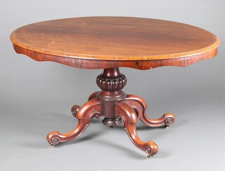 A Victorian oval rosewood Loo table, raised on turned column and tripod base with ceramic casters 72cm h x 136 w x 103cm d 