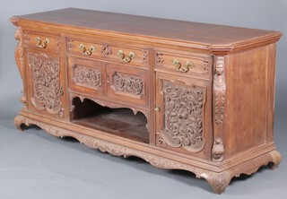 An impressive 19th Century Continental carved oak dresser base fitted a drawer above cupboard and recess, flanked by 2 drawers above cupboards enclosed by panelled doors, raised on cabriole supports 94cm h x 220cm w x 68cm d 