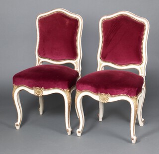 A pair of 19th Century grey painted salon chairs, the seat and back upholstered in red material, raised on cabriole supports 96cm h x 50cm w x 43cm d (seats 30cm x 25cm) 