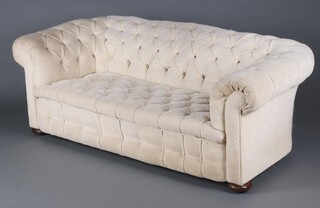 A Victorian 2 seat Chesterfield upholstered in white buttoned material, raised on bun feet 66cm h x 181cm w x 84cm d  (seat 110cm x 48cm) 