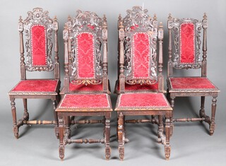 A set of 6 Victorian carved oak Carolean style dining chairs, the seats and backs upholstered in red material, raised on turned and fluted supports 115cm h x 48cm w x 40cm d (seats 28cm x 28cm) 