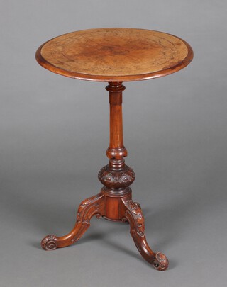 A Victorian circular quarter veneered and inlaid figured walnut wine table, raised on turned column and tripod base 69cm h x 50cm diam. 