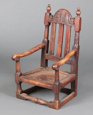 A child's 17th Century elm stick and bar back open arm chair, the crest marked T H, raised on turned and block supports 61cm h x 35cm w x 31cm d (seat 25cm x 21cm) 