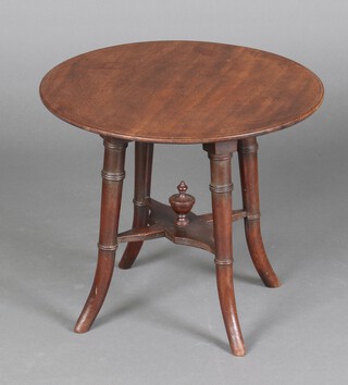 An Edwardian circular mahogany occasional table with X framed stretcher, raised on outswept supports 41cm h x 49cm diam. 